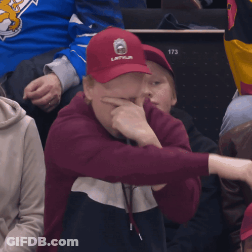 Man In Red Latvija Hat Covering Face GIF