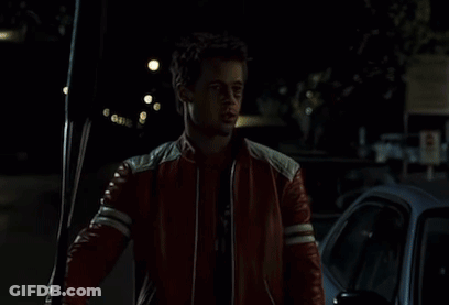 Man In Red Leather Jacket Holding Soda GIF