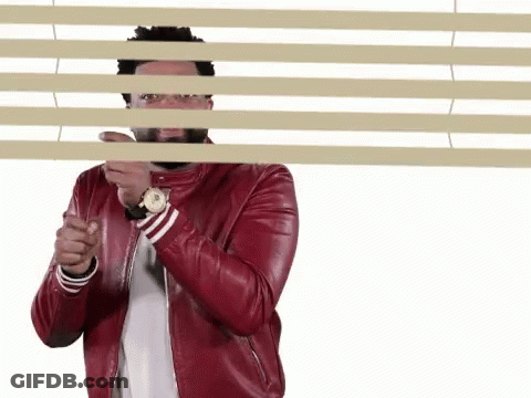Man In Red Leather Jacket Peeking GIF