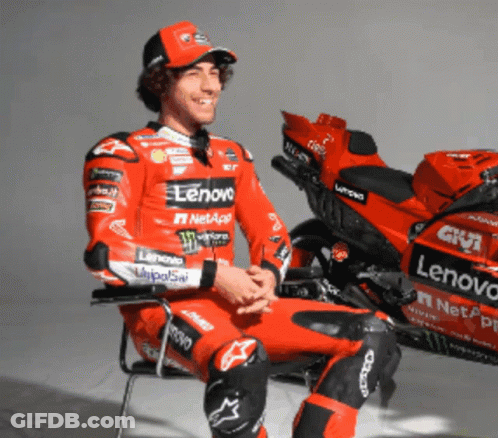 Man In Red Lenovo Racing Suit With Red Motorcycle GIF