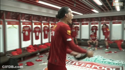 Man In Red Liverpool Jersey In Locker Room GIF