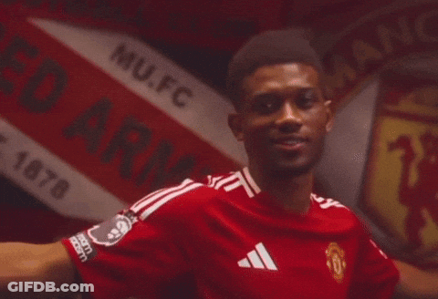 Man In Red Manchester United Jersey By Sign GIF
