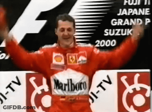 Man In Red Marlboro Shirt In Front Of Fuji Sign GIF