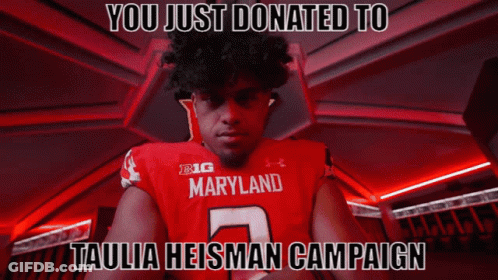 Man In Red Maryland Jersey Standing In Dark Room GIF