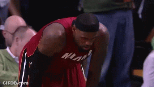 Man In Red Miami Jersey Looking Down GIF