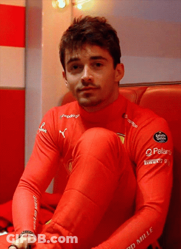 Man In Red Mille Shirt Sitting GIF
