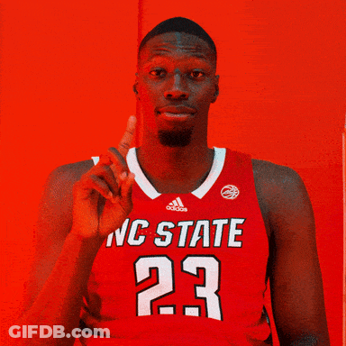 Man In Red NC State Jersey Pointing Up GIF