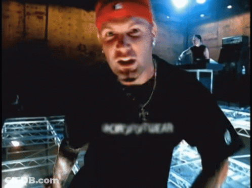 Man In Red Nike Headband And Black Drum Shirt GIF
