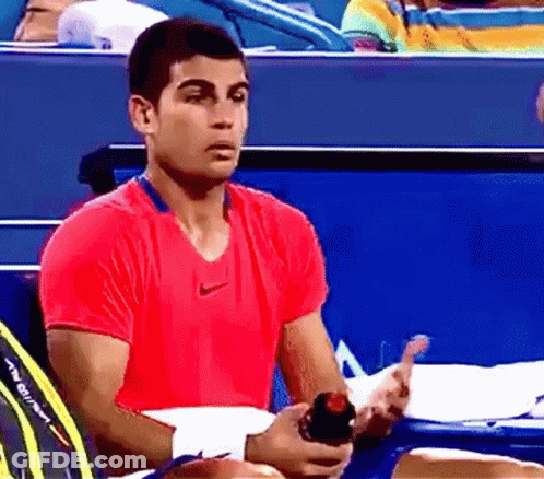 Man In Red Nike Shirt Holding Water Bottle GIF