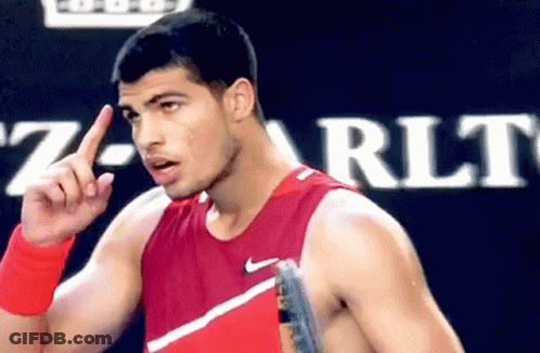 Man In Red Nike Tank Top Pointing Up GIF