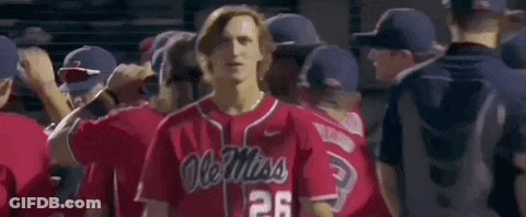 Man In Red Ole Miss Baseball Jersey Standing In Front Of Crowd GIF