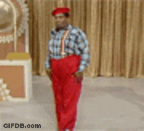 Man In Red Pants And Suspenders Standing GIF