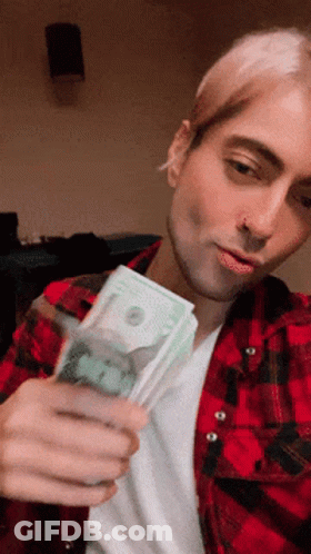 Man In Red Plaid Shirt Holding Stack Of Money GIF