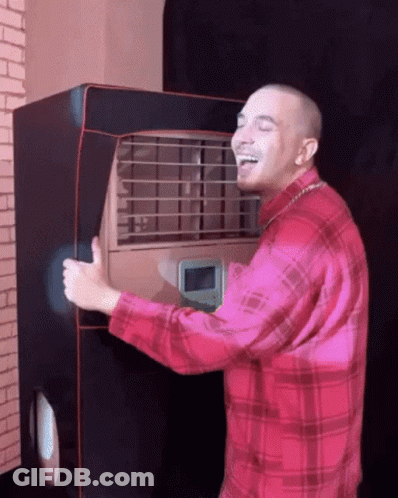Man In Red Plaid Shirt Laughing Holding Machine GIF