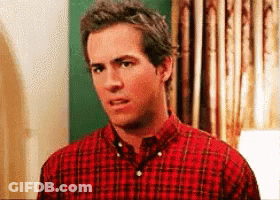 Man In Red Plaid Shirt Looking At Camera GIF