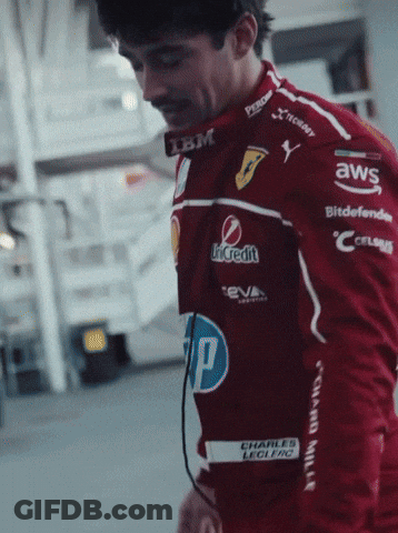 Man In Red Racing Jacket With Sponsors GIF