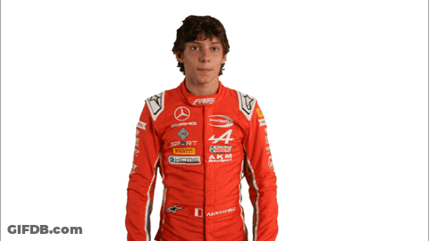 Man In Red Racing Suit With AKM GIF