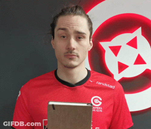 Man In Red Randstad Shirt Holding Notebook GIF