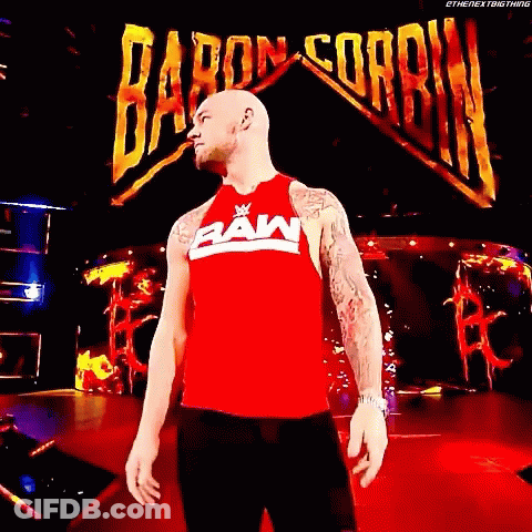 Man In Red Raw Tank Top Baron Corbin Sign GIF