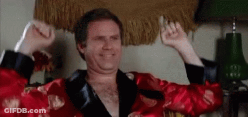 Man In Red Robe Flexing Muscles GIF