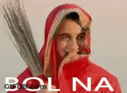 Man In Red Robe Holding Broom GIF
