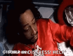 Man In Red Robe Laying In Bed Saying Pimp In Distress GIF