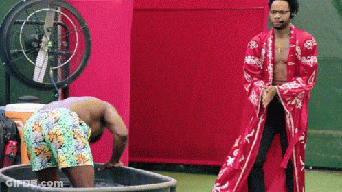 Man In Red Robe Next To Man In Bathtub GIF