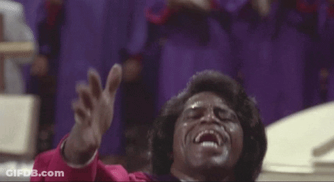Man In Red Robe Singing Into Microphone GIF