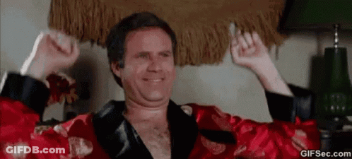 Man In Red Robe Sitting Arms In Air GIF