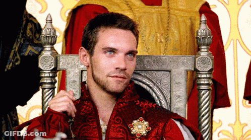 Man In Red Robe Sitting In Throne GIF