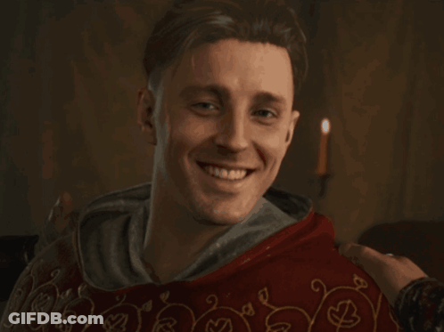 Man In Red Robe Smiling GIF
