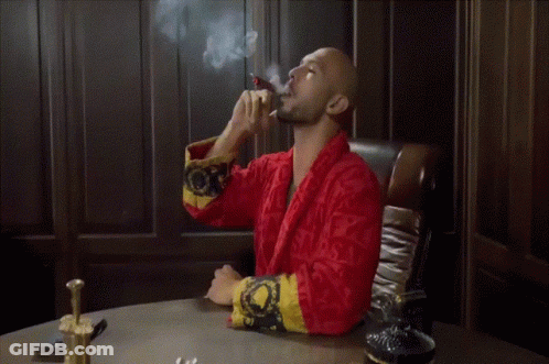 Man In Red Robe Smoking Cigar GIF