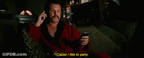 Man In Red Robe Talking On Phone GIF