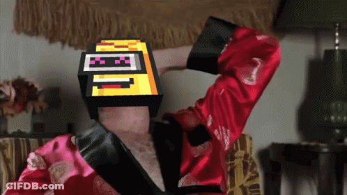Man In Red Robe With Pixelated Cube Saying I GIF