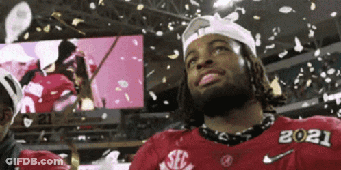 Man In Red SEC Jersey Standing In Front Of Confetti GIF