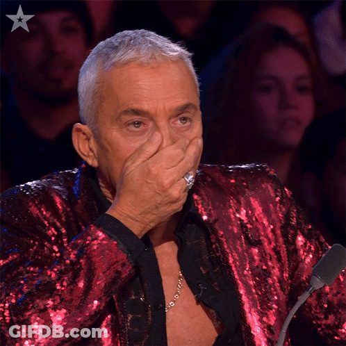 Man In Red Sequined Jacket Covering Mouth GIF
