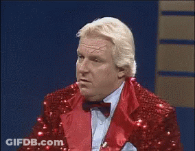 Man In Red Sequined Suit And Bow Tie Funny Face GIF