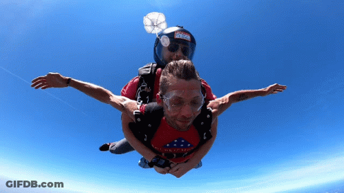 Man In Red Shirt 'America' Lifted By Another Man GIF
