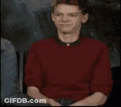 Man In Red Shirt And Black Collar Close Up GIF