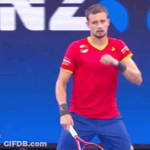 Man In Red Shirt And Blue Shorts Holding Tennis Racket GIF