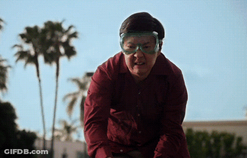 Man In Red Shirt And Goggles Looks Angry GIF