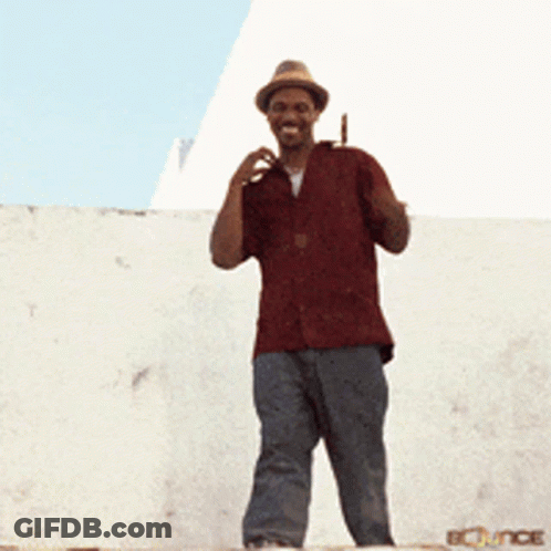 Man In Red Shirt And Hat Waving GIF