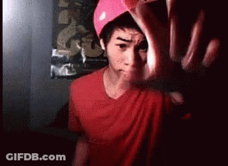 Man In Red Shirt And Pink Hat Making Funny Face GIF