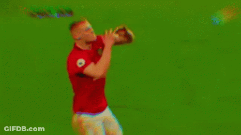 Man In Red Shirt And White Shorts Holding Soccer Ball GIF