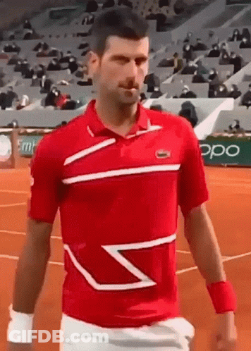 Man In Red Shirt And White Shorts Walking On Tennis Court GIF