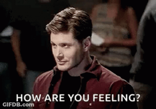 Man In Red Shirt Asking How Are You Feeling In Crowd GIF