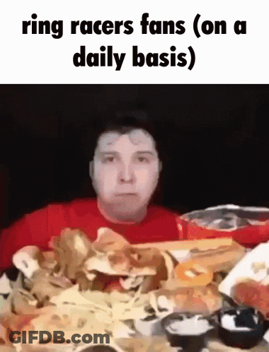 Man In Red Shirt At Table With Pile Of Food GIF