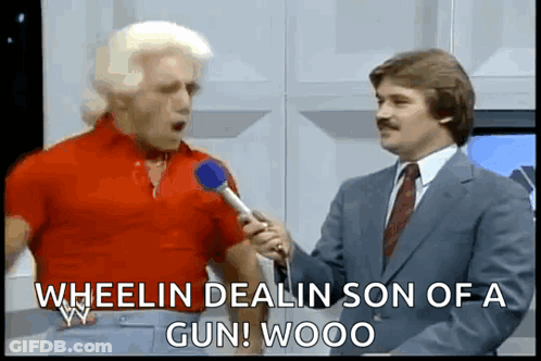 Man In Red Shirt Being Interviewed GIF