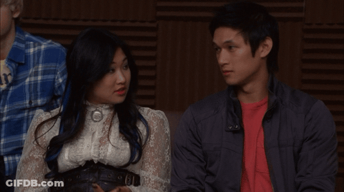Man In Red Shirt Beside Woman In White Shirt GIF