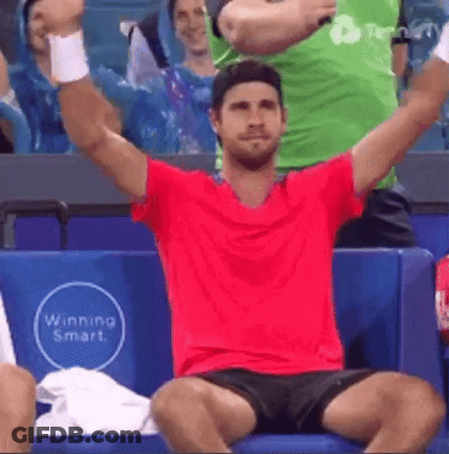 Man In Red Shirt Black Shorts Arms Up GIF